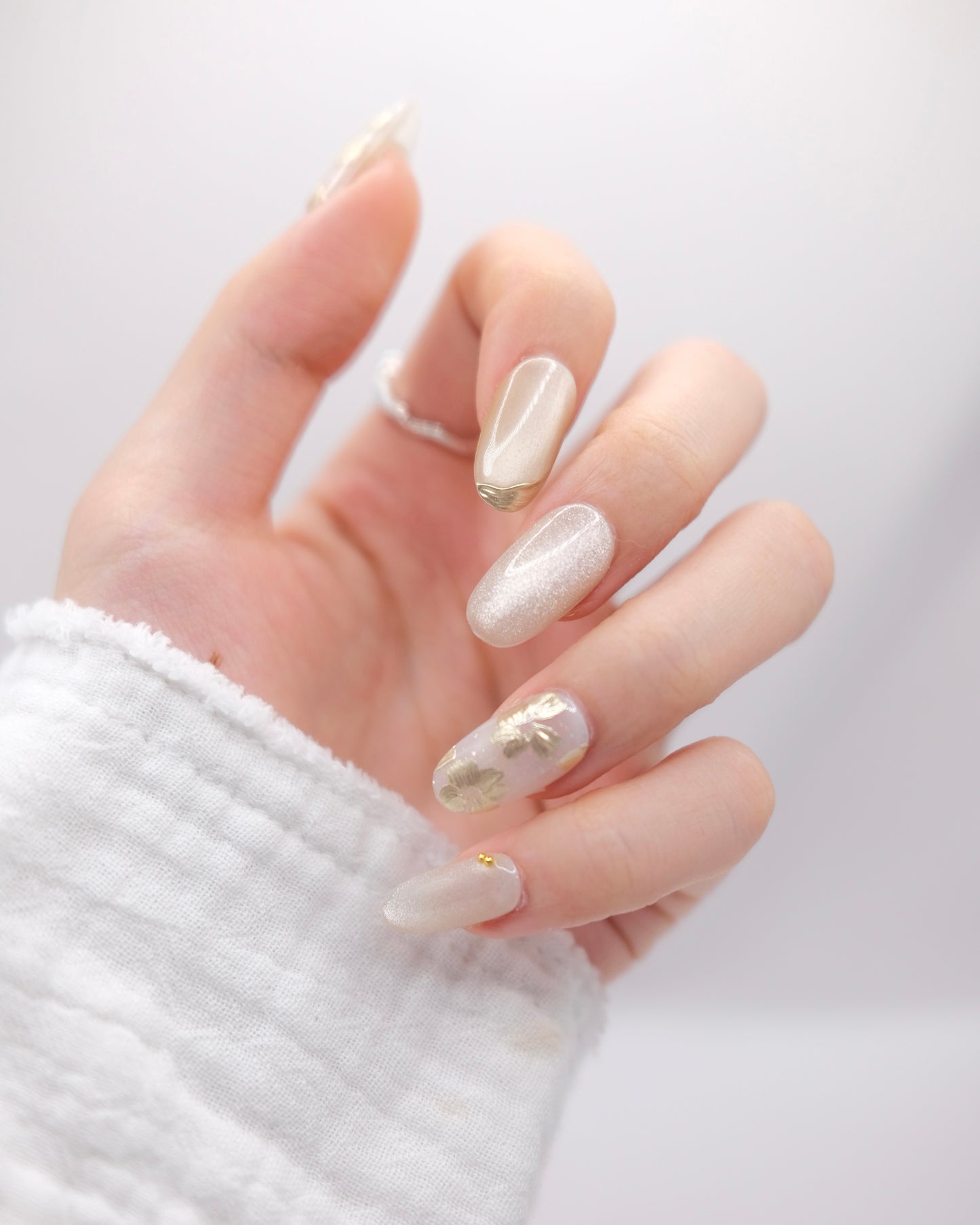Mid-Long Almond Gold & White Cateye Embossed Flower Press On Nails