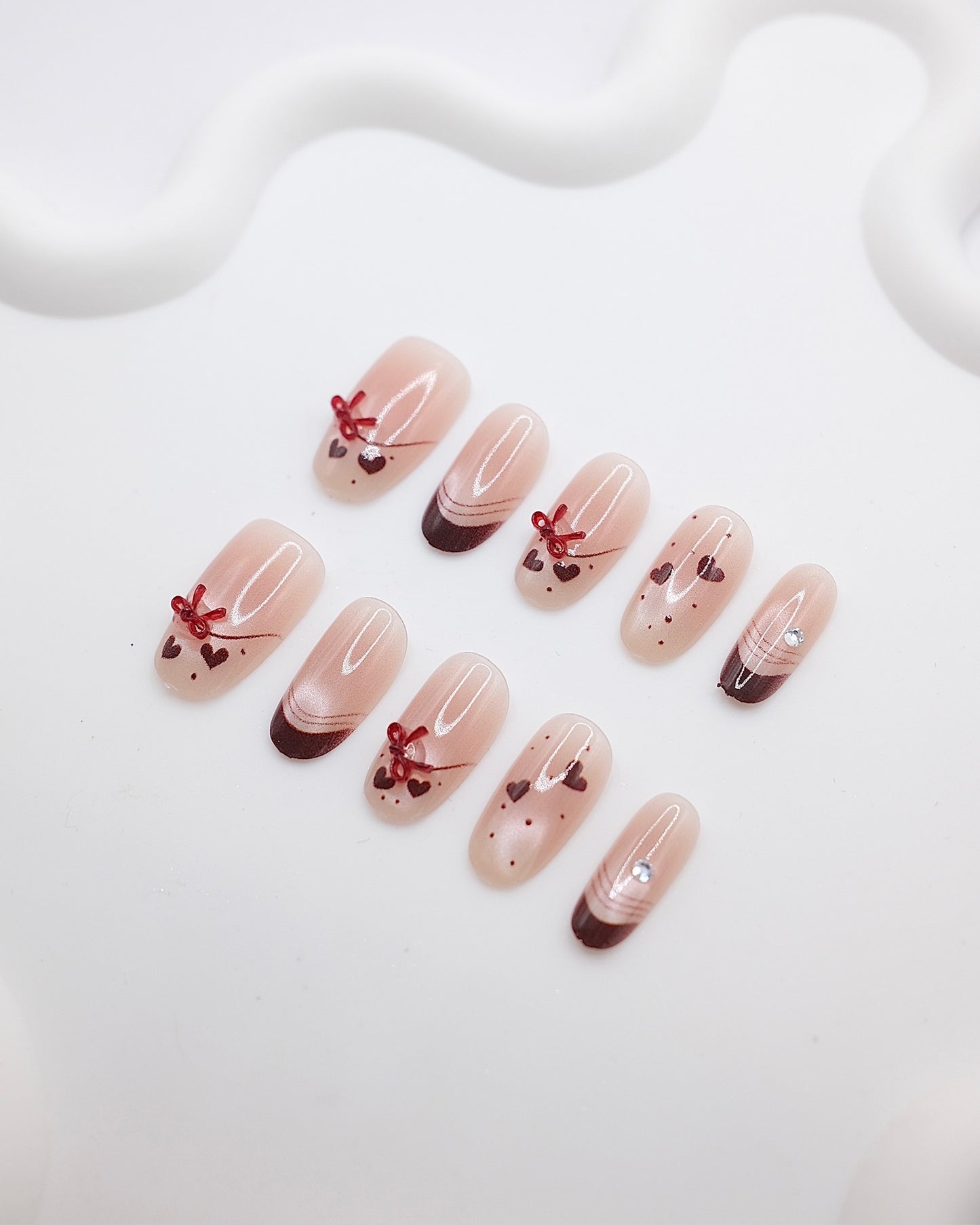 Mid-Long Oval Nude Color & Red Bowtie Press On Nails